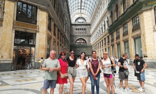 A group of tourists in naples on a walking tour.