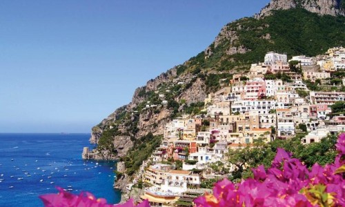 Amalfi Coast shoreline with flowers. Naples, Italy.